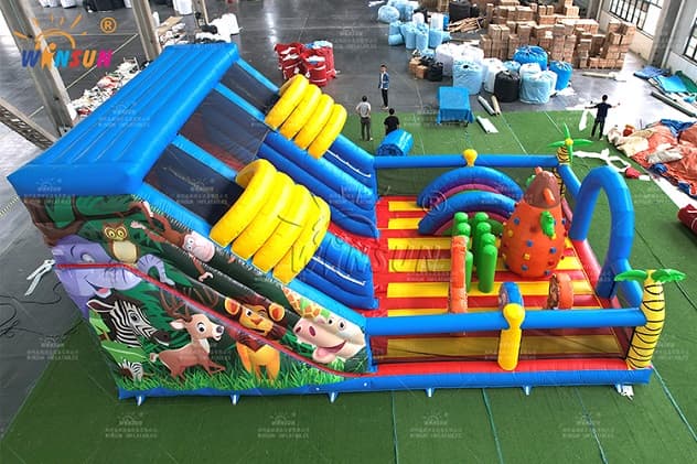 Giant inflatable slide with bounce area and climbing wall for kids' parties