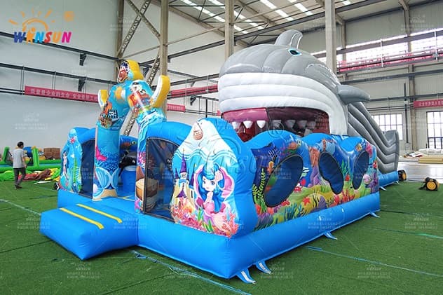 Inflatable fun city with shark moving mouth slide